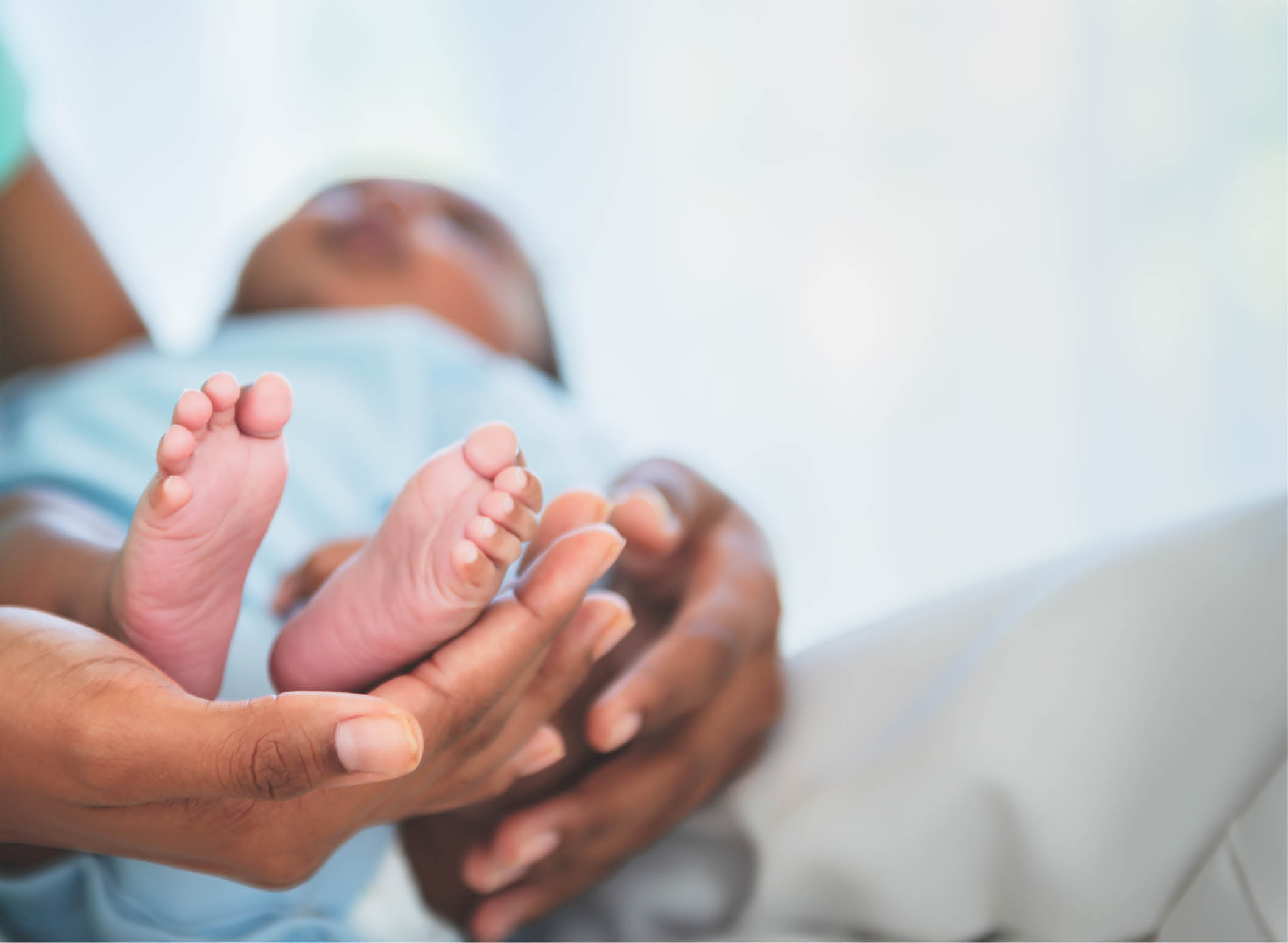 Blurred soft images, Baby's foot of African black skin newborn, Placed on the mother's hand, concept to showing love and concern for her children, And is love family relationship.