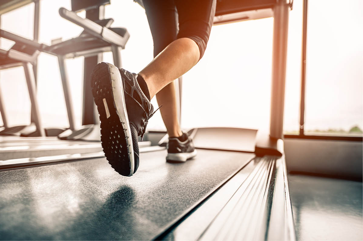 Close up on shoe,Women running in a gym on a treadmill.exercising concept.fitness and healthy lifestyle 