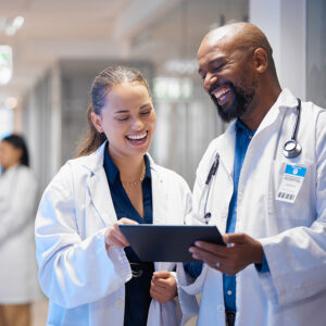 A medical student presents a patient to a doctor.