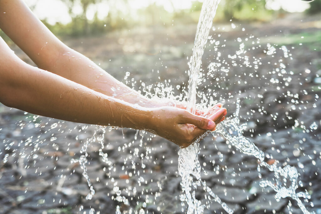 Water pouring into hands.