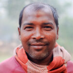 Portrait of a middle aged man originally from rural Bangladesh.